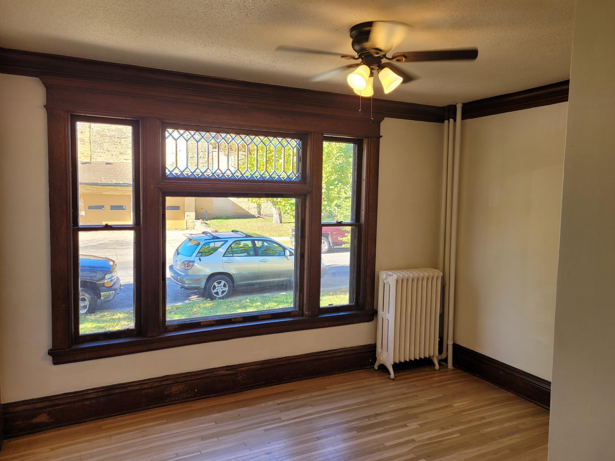 Leaded window, natural woodwork and hardwood floors.