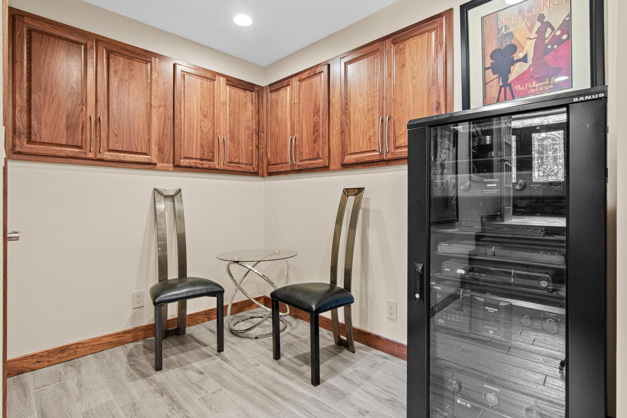 Located just off the family/theater room, perfect for media and plenty of storage.