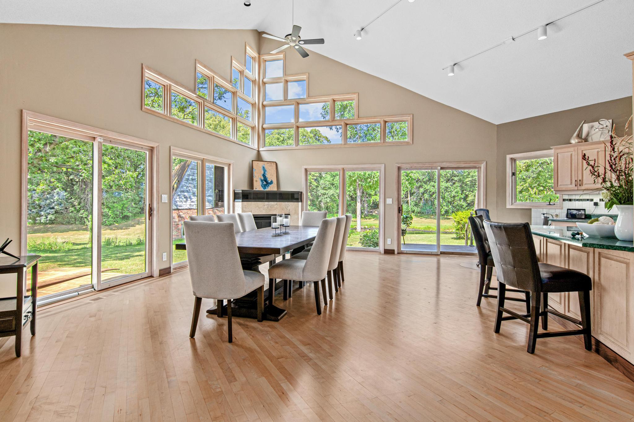 Vaulted ceilings, light and bright with walkouts to enjoy the setting. This space is huge and could accommodate both a family room open to the kitchen and a large area for dining!