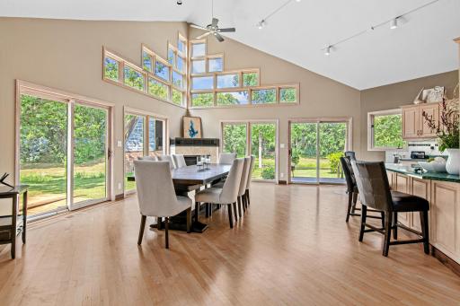 Vaulted ceilings, light and bright with walkouts to enjoy the setting. This space is huge and could accommodate both a family room open to the kitchen and a large area for dining!