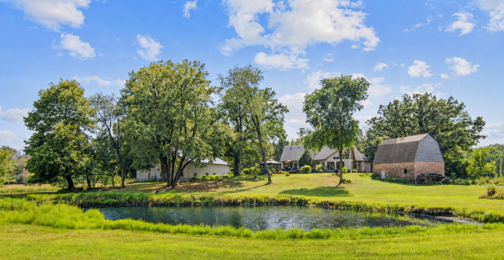 Picturesque pond, vintage barn, and huge outbuilding, all beautifully finished, offering exceptional and stunning views from the home and owner’s suite