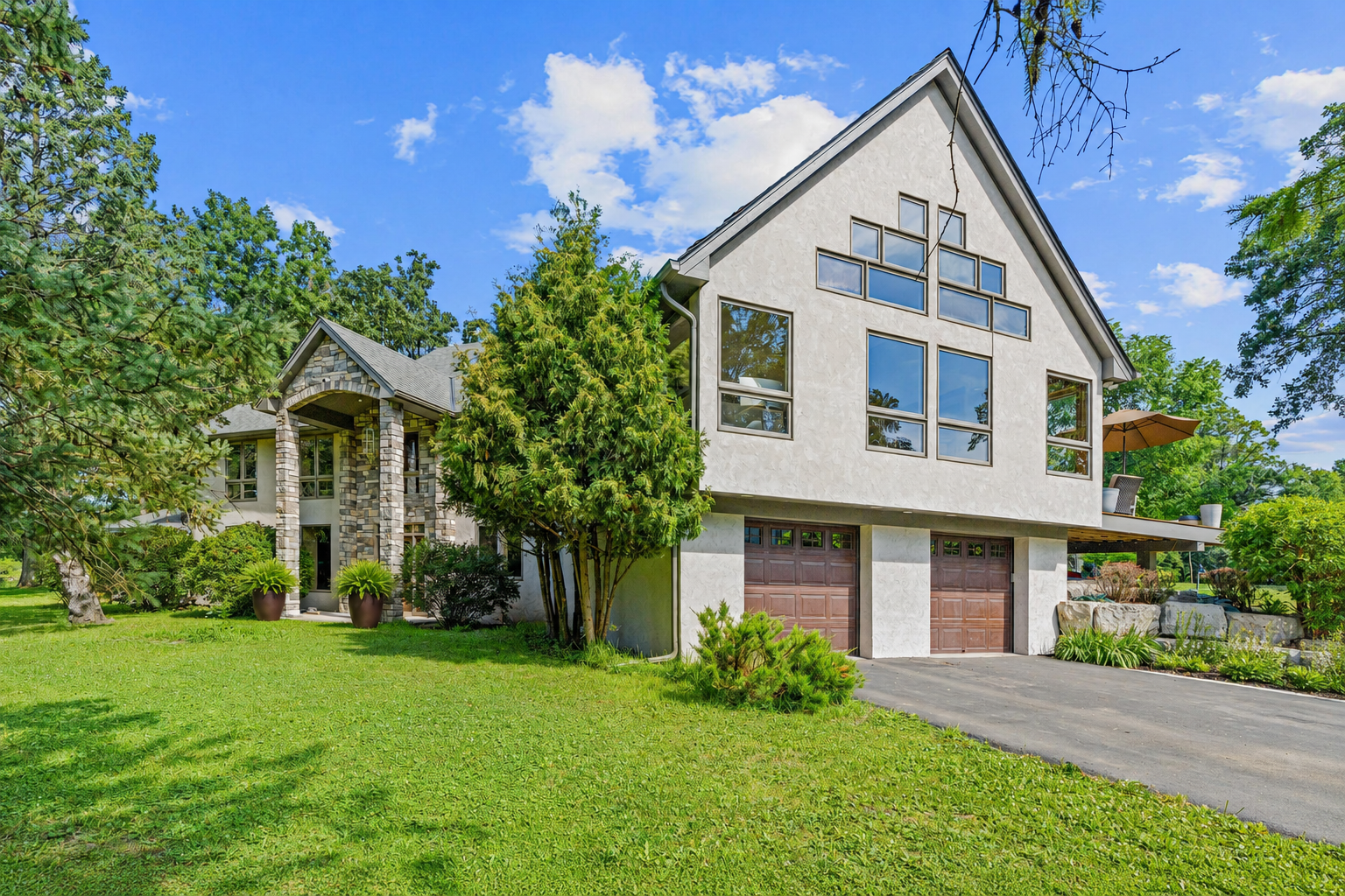 Thoughtfully designed windows throughout this home invite the outdoors in, filling the space with beautiful natural light and creating the perfect setting to enjoy its private, peaceful surroundings.