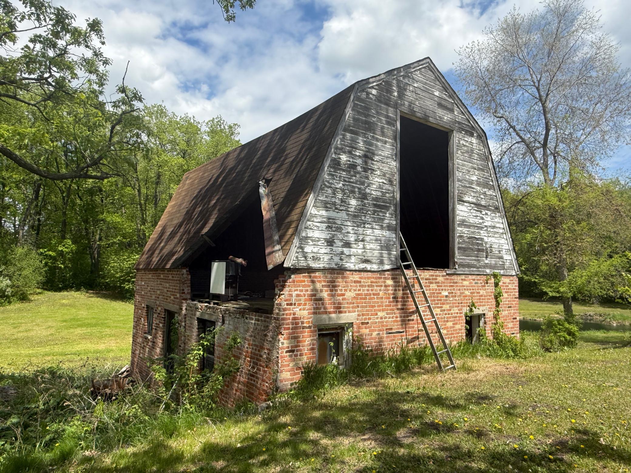 Imagine the possibilities! Original barn with upper-level loft and lower-level tack room—perfect for a hobby farm, horses, or creative retreat. A timeless structure ready to be re-imagined into your dream estate setting.