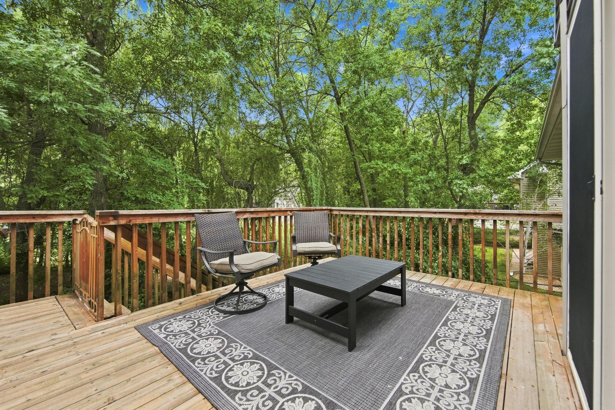 Deck overlooking the treed backyard!