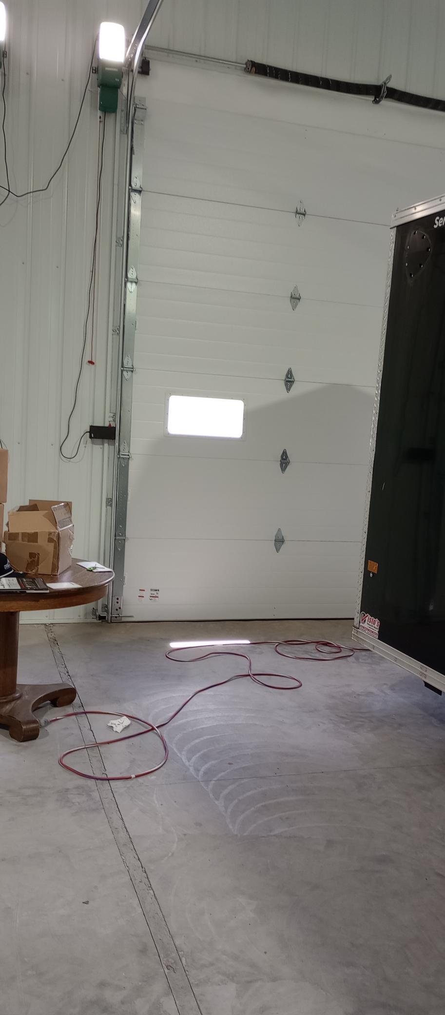 Units have cement floors and 12' overhead garage doors