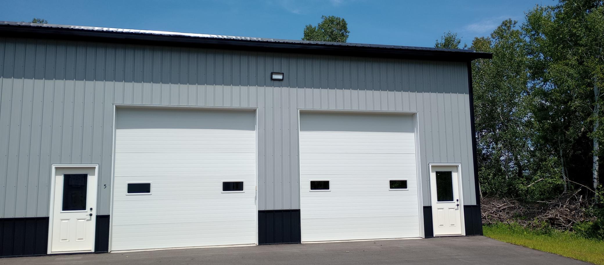 Units 5 & 6, separate garage doors, but interior has no dividing wall.