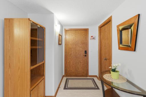 Inviting and bright entryway in your condo with large closet.
