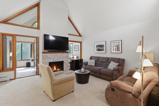 Warm and inviting living room centered around the fireplace.