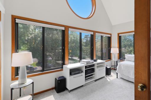 Bright and inviting sunroom filled with natural light and views of the outdoors.
