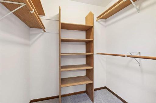 Large walk-in closet in the primary bedroom. One of 2 closets + a linen closet in the primary suite.