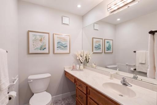 Updated powder bath with new flooring, trim and grab bars. Virtually staged.