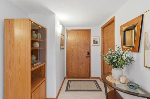 Inviting and bright entryway in your condo with large closet.