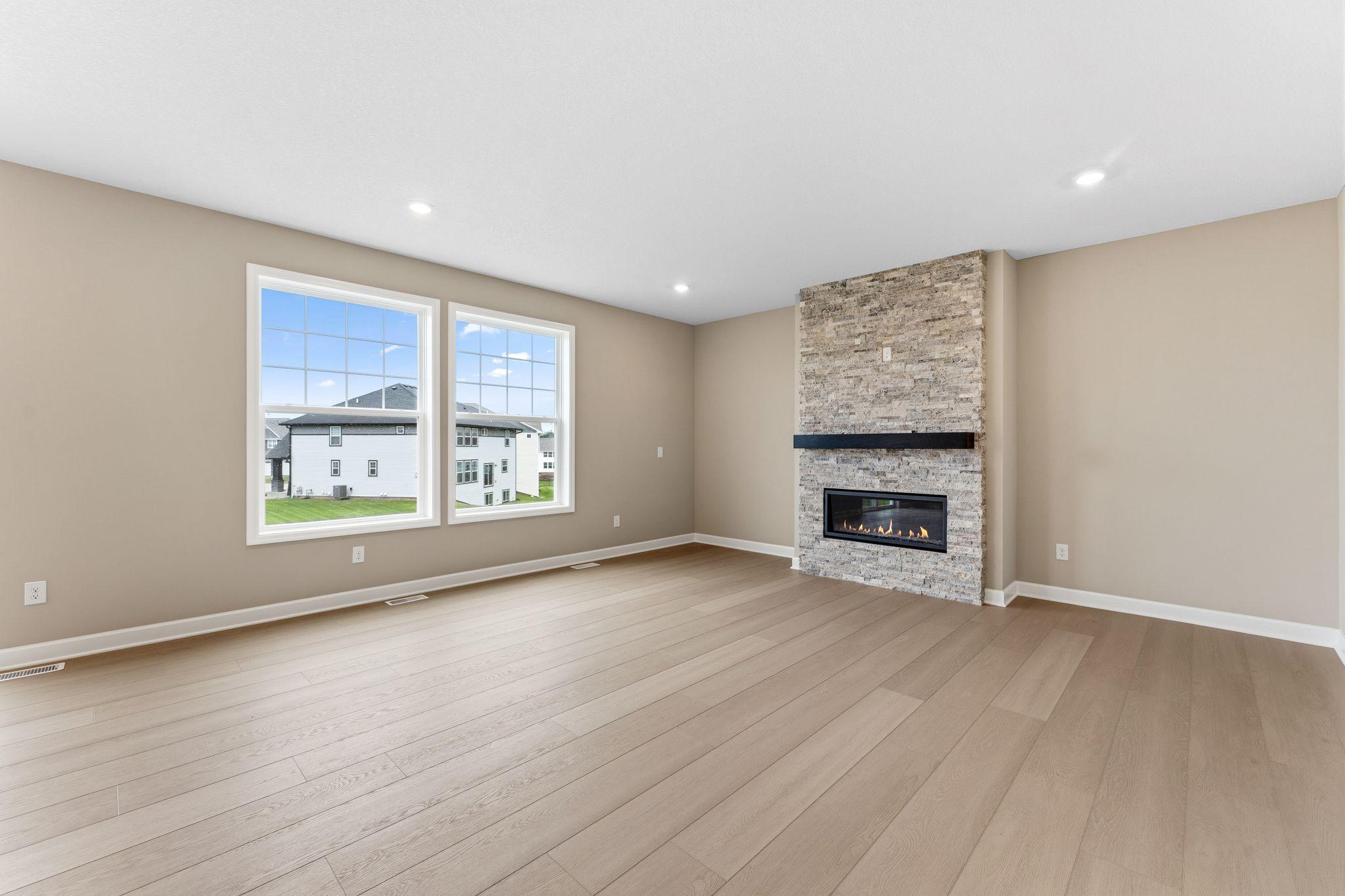 The Great Room features large windows for ample natural light and is the perfect place for gathering with friends and family.