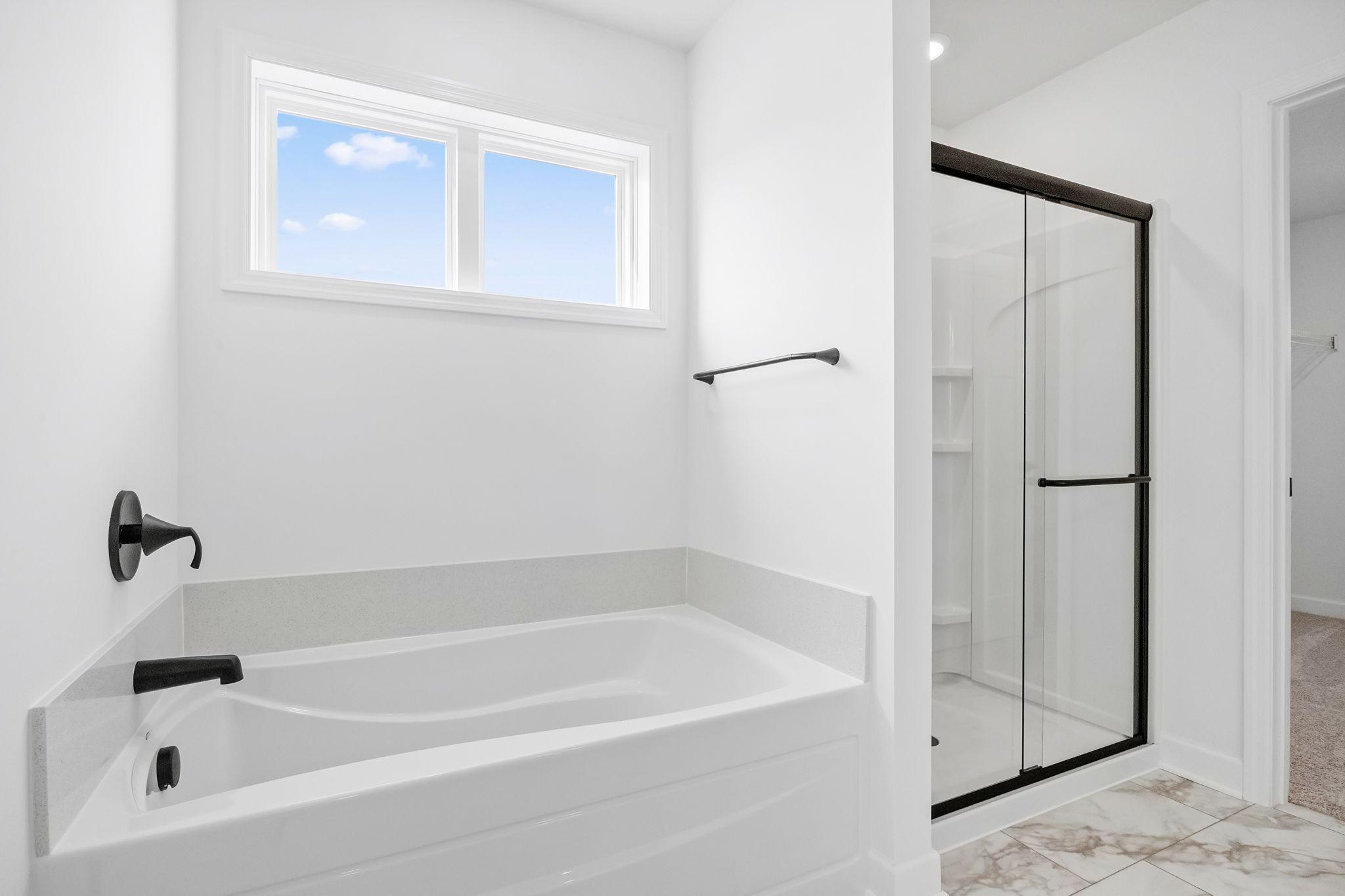The en-suite bathroom has dual sinks to simplify any morning routine