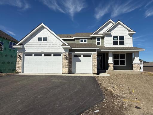 Welcome to 14724 Lanewood Circle N! (Photo is of the actual home.)