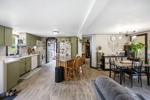 Open concept kitchen, dining and living rooms