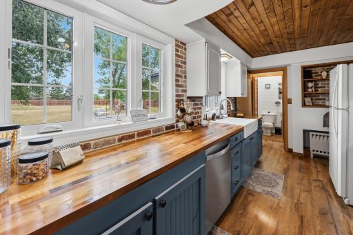 Kitchen. Large windows overlooking the backyard.