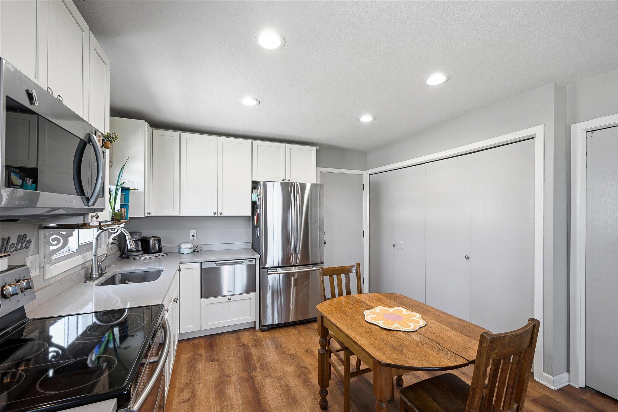 Enter the kitchen directly from the garage. Laundry and walk-in pantry conveniently located behind the closet doors.