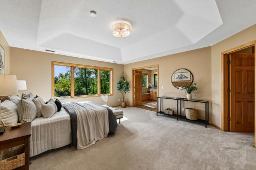 Upper Level Primary Bedroom Suite overlooking the backyard pond and wetlands