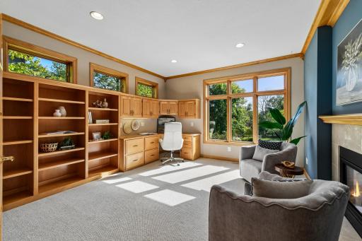 Main floor rear south pond facing office with east facing transom windows for early light in this space