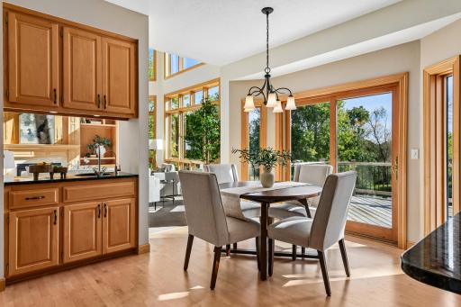 Glorious south facing light in this eat in dining area. The wet bar service area as shown on the left features a sink with an RO system.