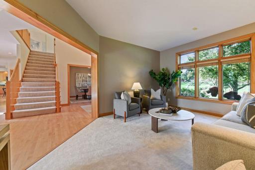 Main floor front sitting room that is a great flex space as an office, music room or library. A future equity add could be to add doors and a closet to make a 5th bedroom.