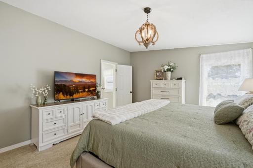 Entry to the primary bath is in the back left corner. There is lots of space for side tables and storage.