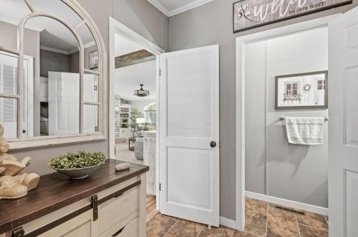 The half bath is attached to the laundry room and off the kitchen.
