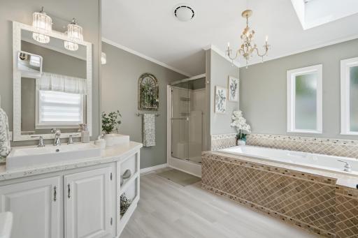The private full bath features separate tub and shower, as well as dual sinks!