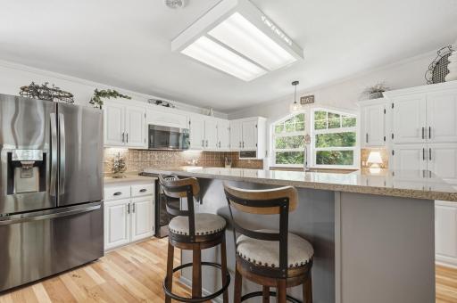 French-door fridge with pull-out freezer is set just to the right of the deck access.