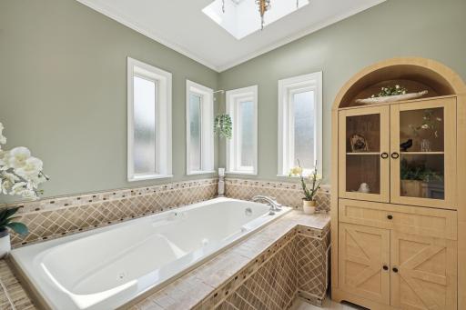 Soak in the tub while you gaze up through the overhead skylight.