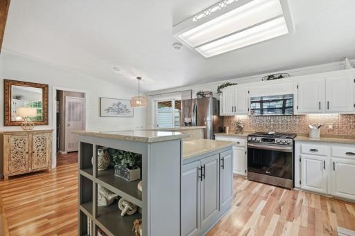 Extra built-in shelving for cookbook storage, mail drop spot, or small appliance storage in the center island.