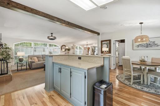 From the kitchen you can view the living space and will have easy access to laundry through the door to the right.