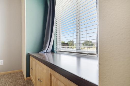 Cozy, convenient window seat with storage drawers!