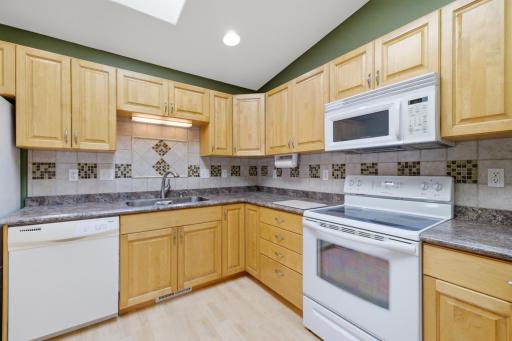 Maple kitchen cabinets, vaulted ceiling, pantry closet