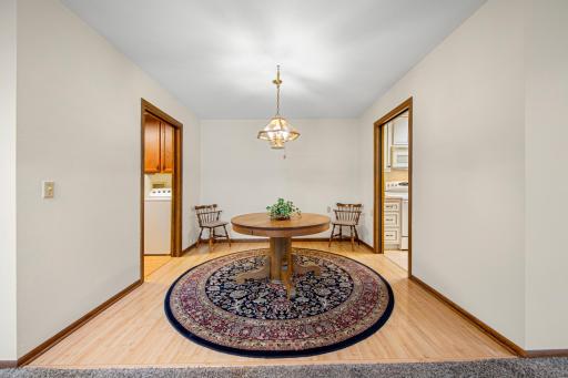 Dining area with kitchen on one side and laundry on the other