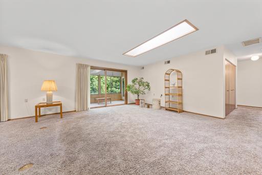 Large living area with skylight and easy access to the porch