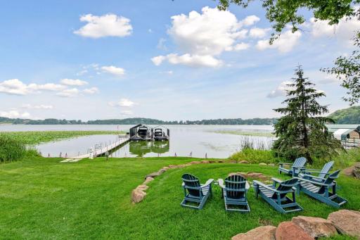 Beautiful fire pit area and lake life views with 2 electronic boat and jet ski lifts