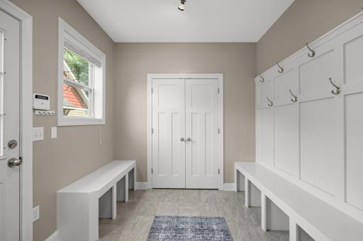 Spacious mudroom leading out to the backyard