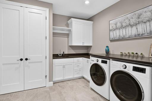 Laundry room is set up for multiple uses...