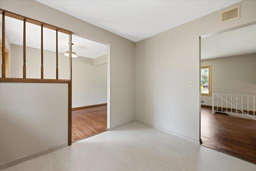 The kitchen's functional layout offers easy access to both the dining room and living spaces, making daily routines and hosting guests comfortable and convenient.