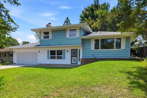 Welcome home to this charming cedar split-level nestled on a beautifully landscaped lot in New Brighton.
