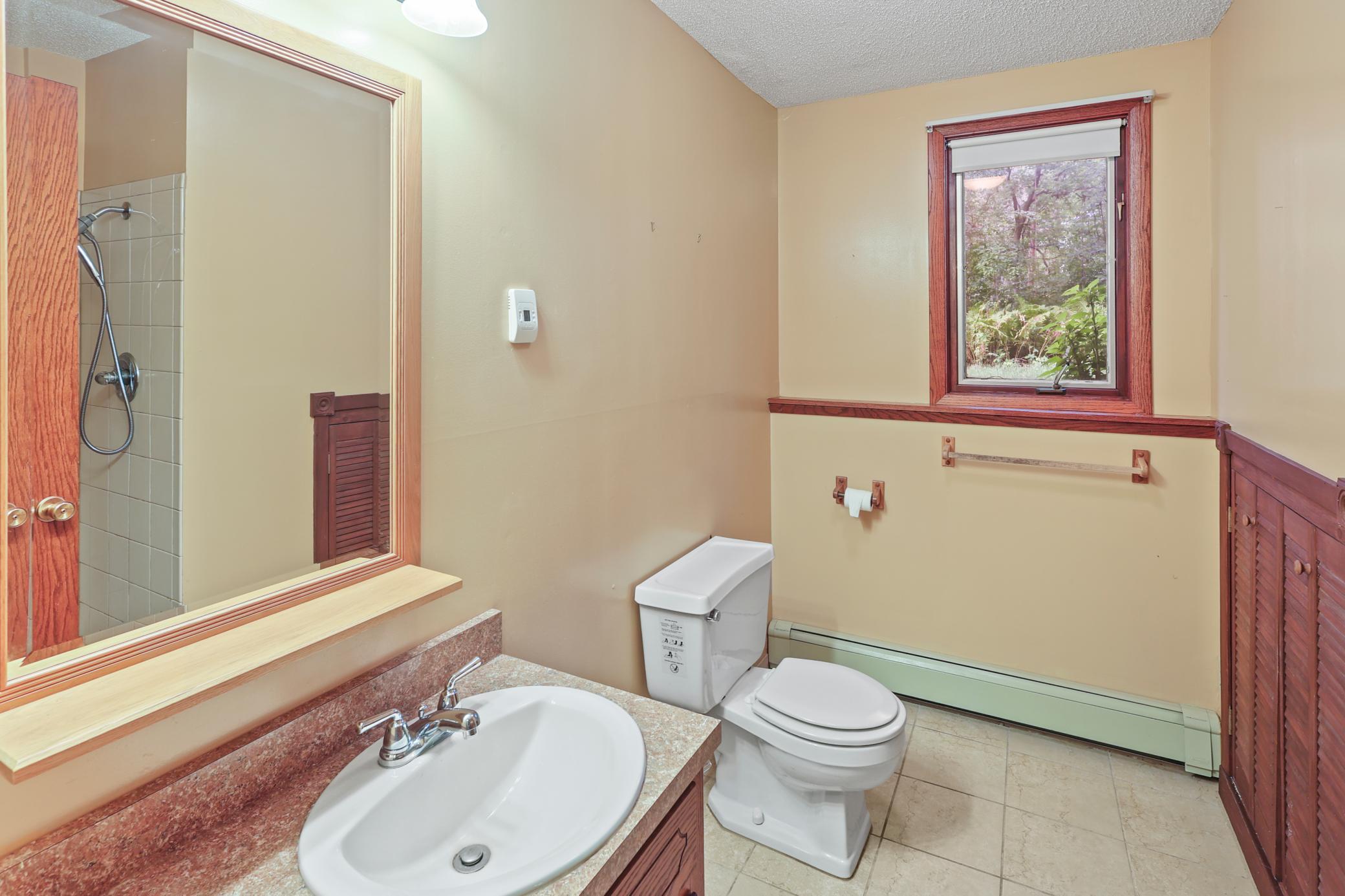 3/4 bath in lower level has large ceramic title Shower