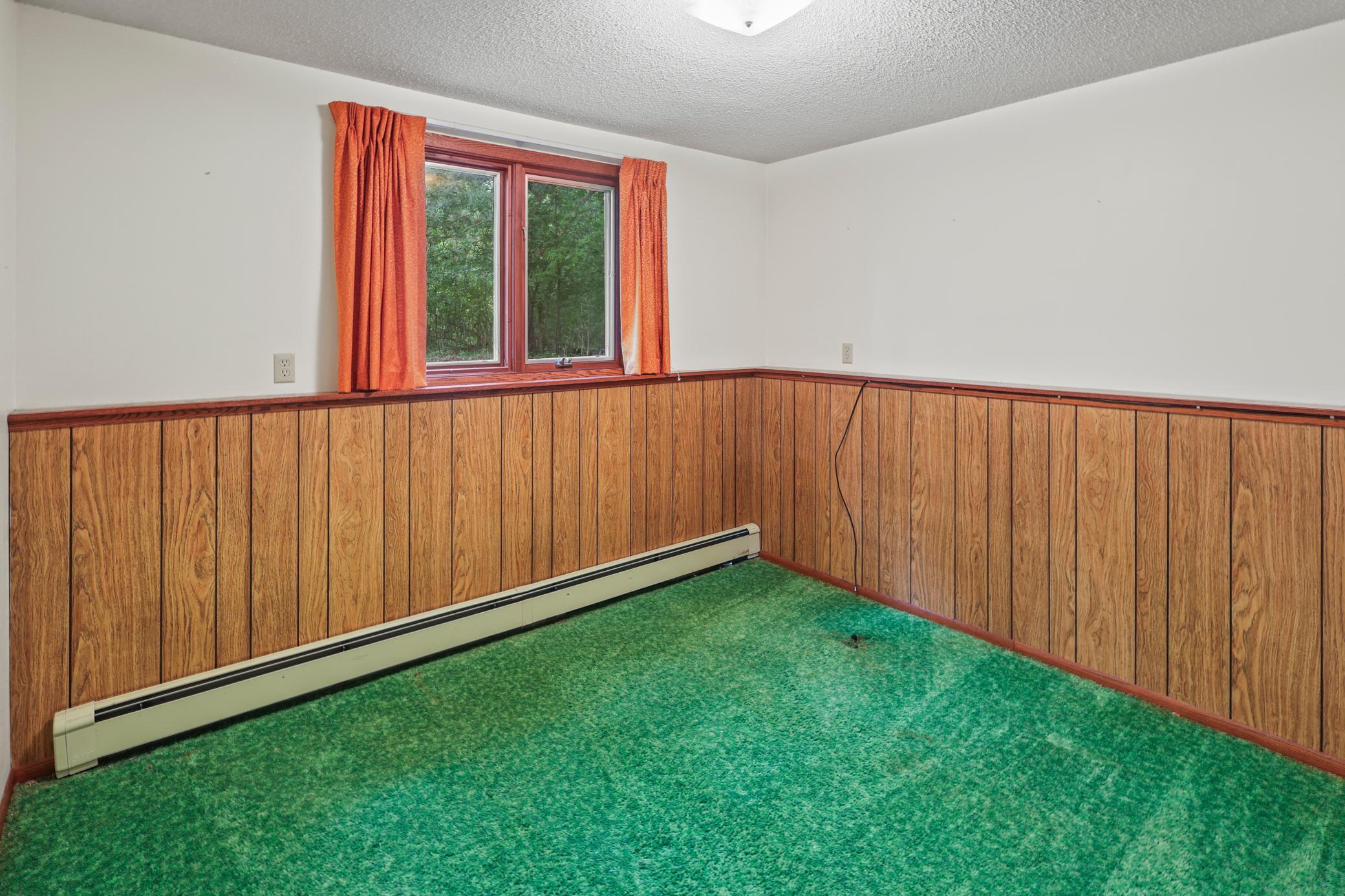3rd bedroom, lower level. just needs some paint and flooring