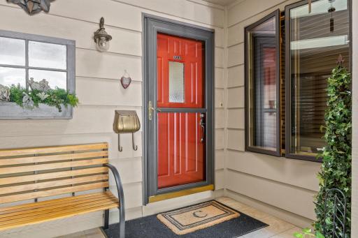 A covered entry portico offers your guests a sheltered entrance