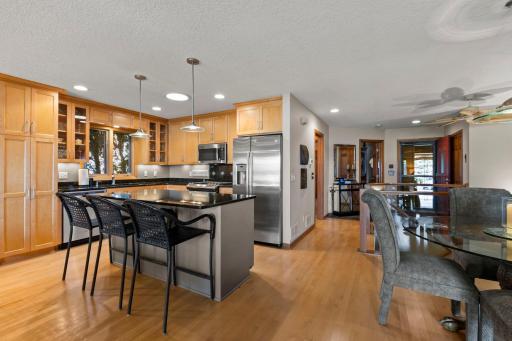 Chefs will love the open Island Kitchen boasting a full line of upgrade stainless-steel appliances, extensive custom cabinetry and ample solid surface countertops