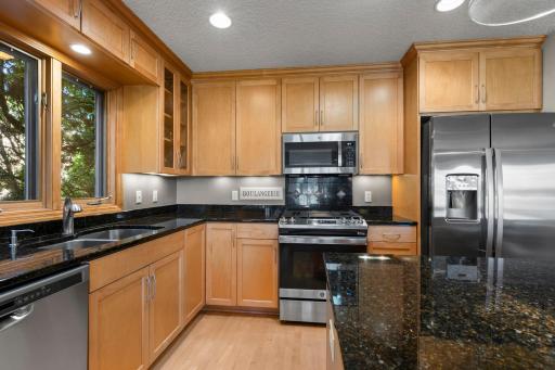 Chefs will love the open Island Kitchen boasting a full line of upgrade stainless-steel appliances, extensive custom cabinetry and ample solid surface countertops