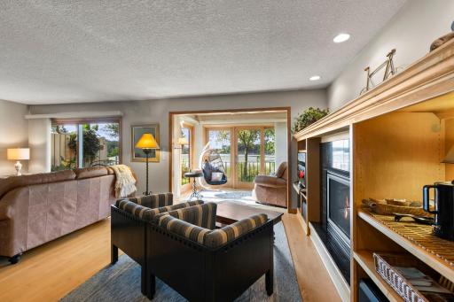 Additional features include beautiful hardwood flooring on the main level and a custom built-in entertainment center in the Great Room