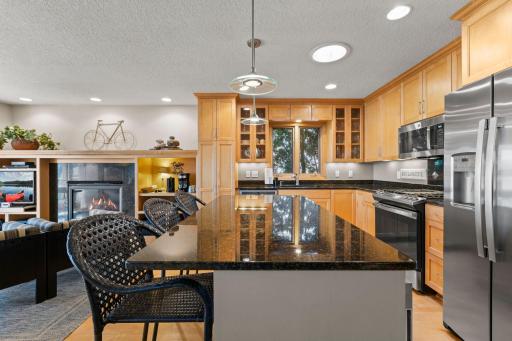 Chefs will love the open Island Kitchen boasting a full line of upgrade stainless-steel appliances, extensive custom cabinetry and ample solid surface countertops
