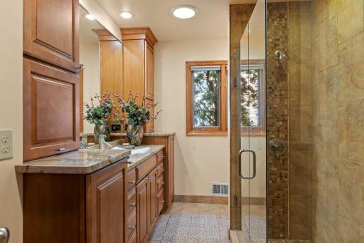 The main floor Bath features custom updates and a walk-in shower